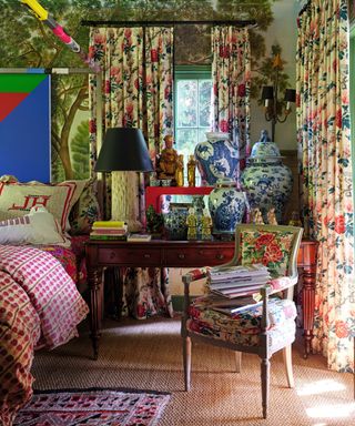 bedroom with floral curtains and chair