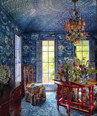 kitchen with red table and red soft chair and blue wall on the wall and ceiling